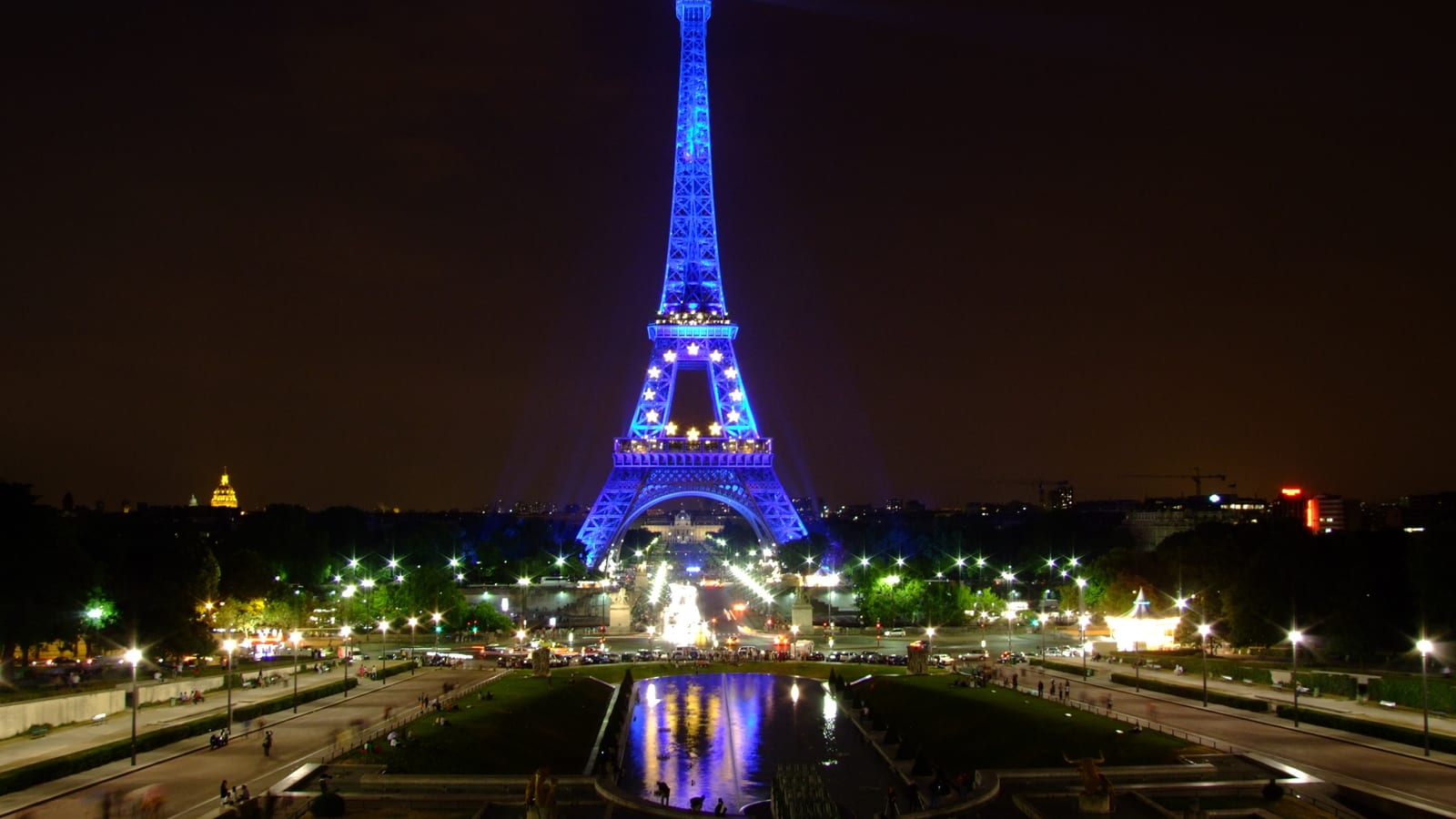 The Eiffel Tower lit at night, seen from the Trocadéro, Paris, France