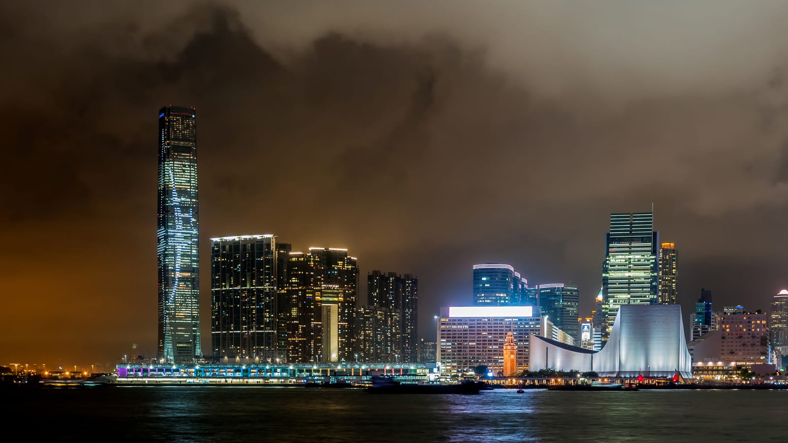 The International Commerce Centre lit above Victoria Harbour at night, Hong Kong